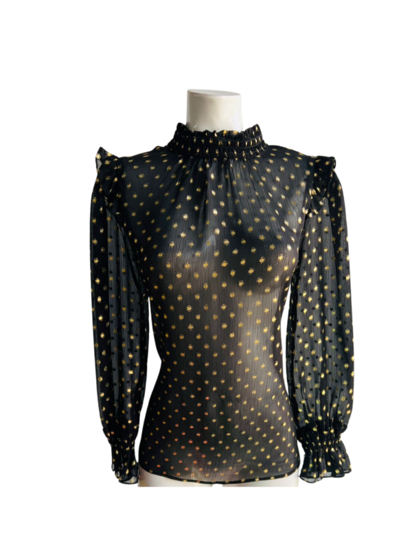 Blusa elegante con brillo sutil